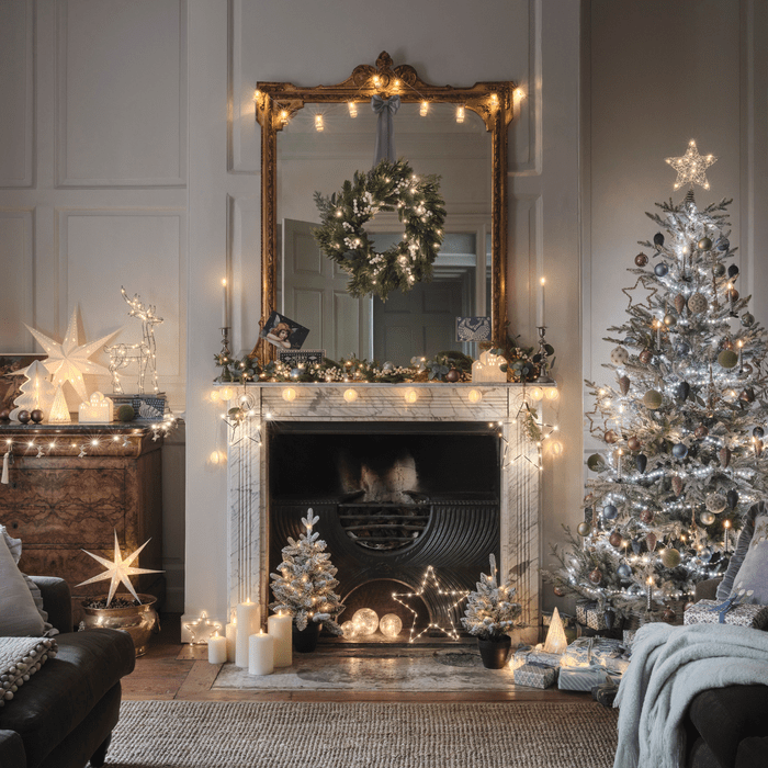 Traditional Living Room with Garland-Adorned Fireplace Traditional Living Room with Garland-Adorned Fireplace — Christmas Lights in Garland Indoor