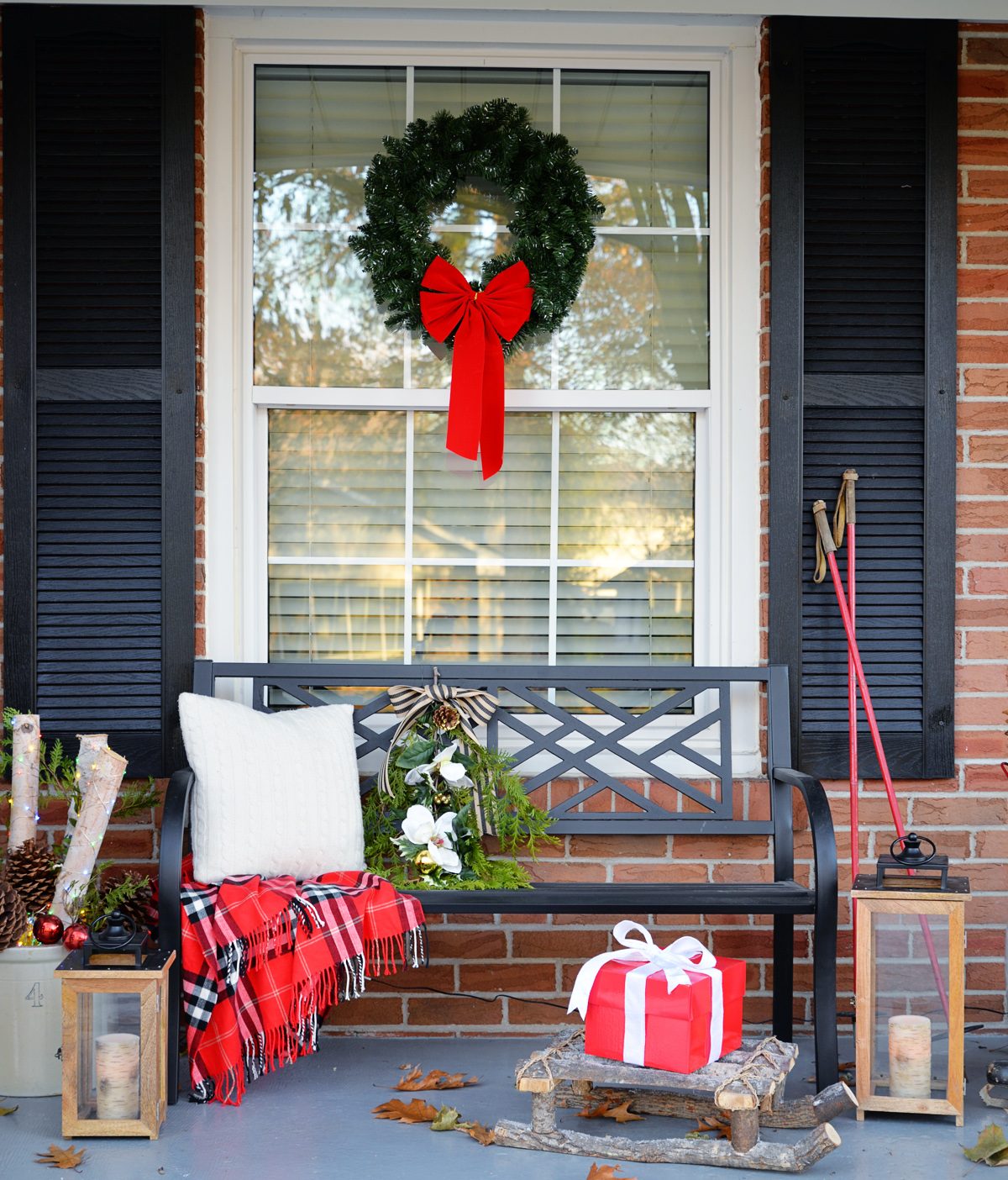 Traditional Porch Wreath with Red Velvet Bow on Window — Christmas Window Wreaths