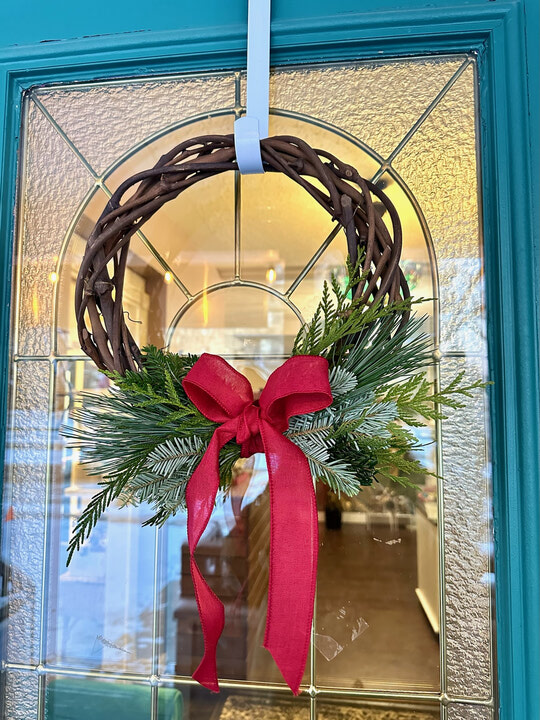 Grapevine Wreath with Pine Sprigs on a Teal Entryway Door — Christmas Window Wreaths