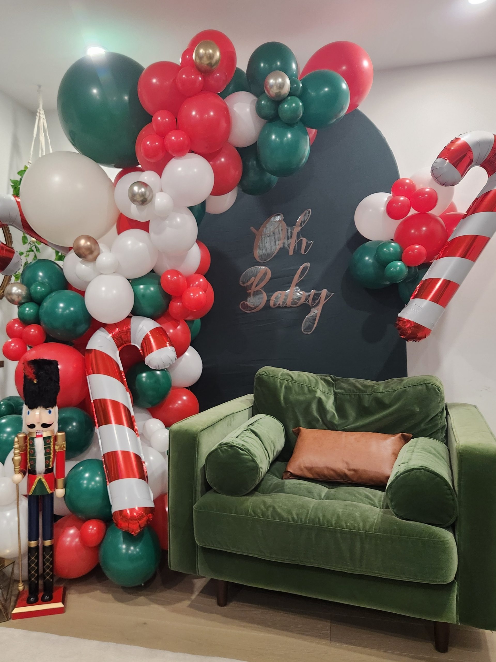 Festive Balloon Arch with Candy Cane and Nutcracker Accents Festive Balloon Arch with Candy Cane and Nutcracker Accents — Christmas Party Backdrop