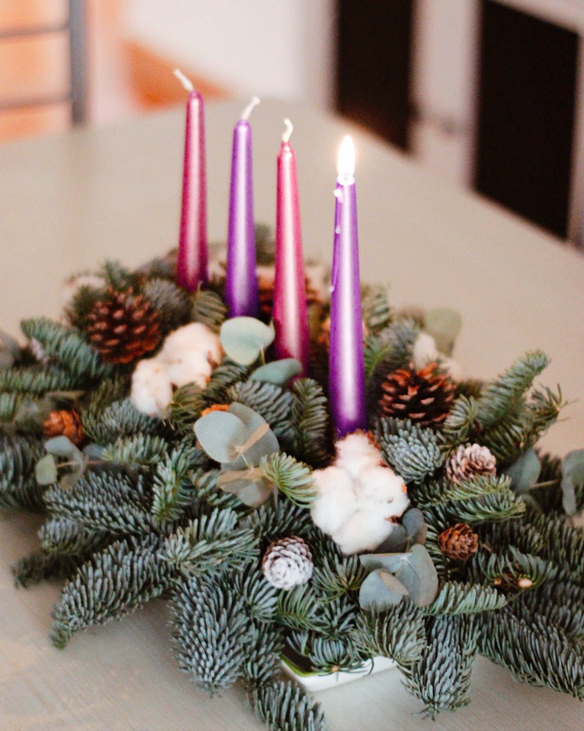 A Purple and Pink Hued Advent Wreath with Natural Accents A Purple and Pink Hued Advent Wreath with Natural Accents