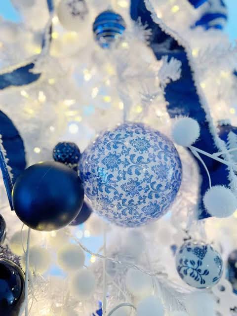 White Christmas Tree with Blue and White Ornaments and Floral Accents White Christmas Tree with Blue and White Ornaments and Floral Accents — Ornament Christmas Tree