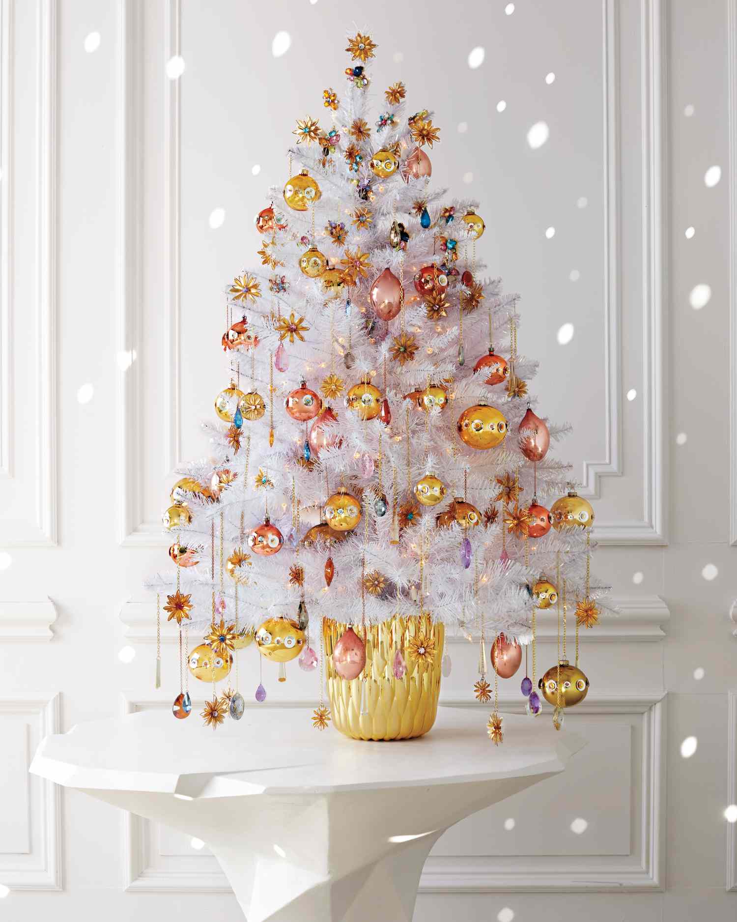 Glamorous white Christmas tree in a gold vase on a pedestal Glamorous white Christmas tree in a gold vase on a pedestal — Gold and White Christmas Tree