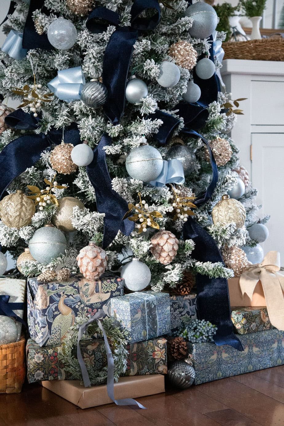 Flocked Tree with Blue/Silver Ornaments and Coordinating Gifts Flocked Tree with Blue/Silver Ornaments and Coordinating Gifts — Blue and Silver Christmas Tree