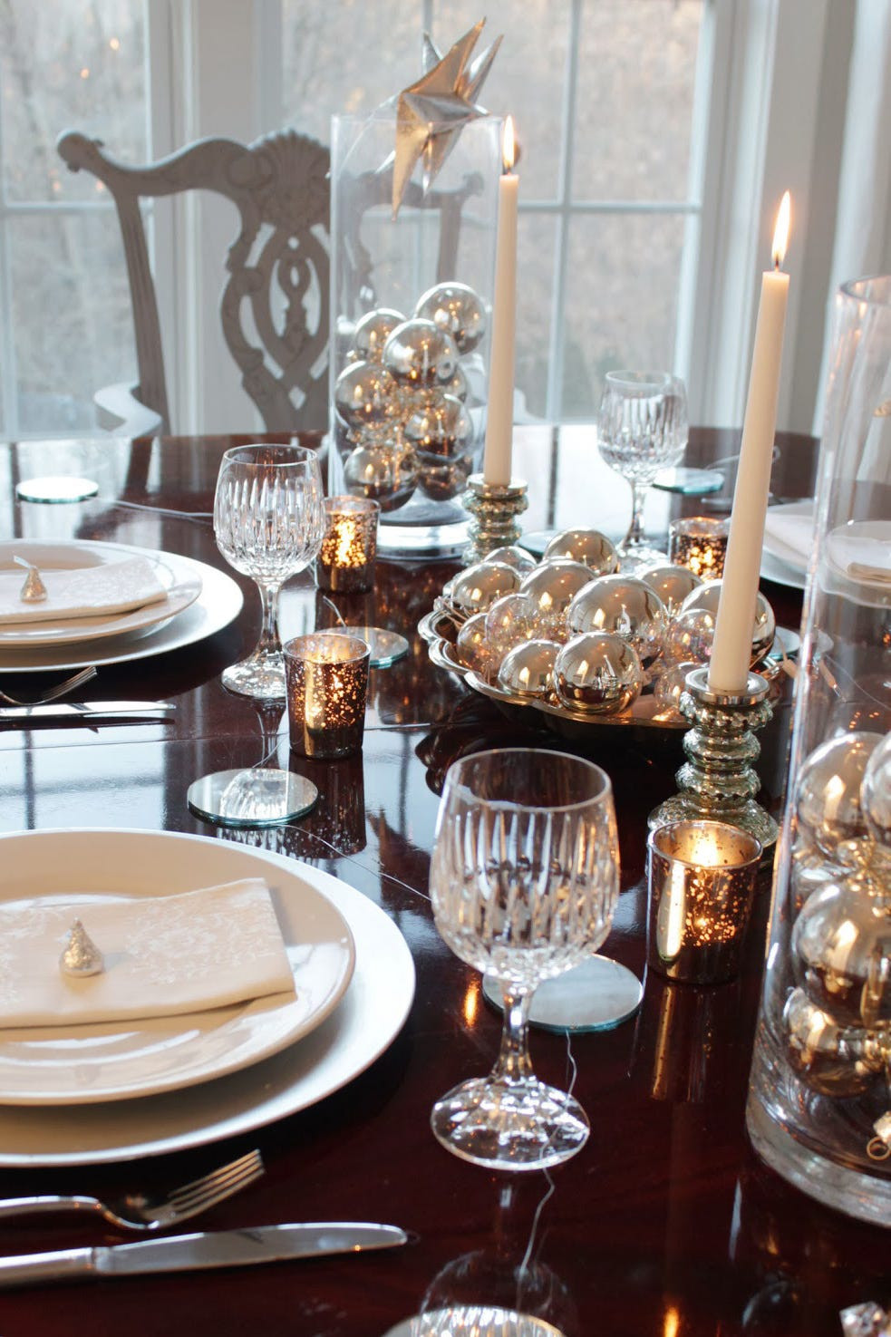 Elegant Dining Table Setting with Crystal Glassware and Silver Ornaments — New Years Eve Party Decor