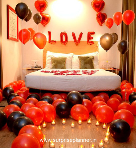 Romantic Bedroom with 'LOVE' Balloon Installation Romantic Bedroom with 'LOVE' Balloon Installation — New Years Eve Date Night at Home