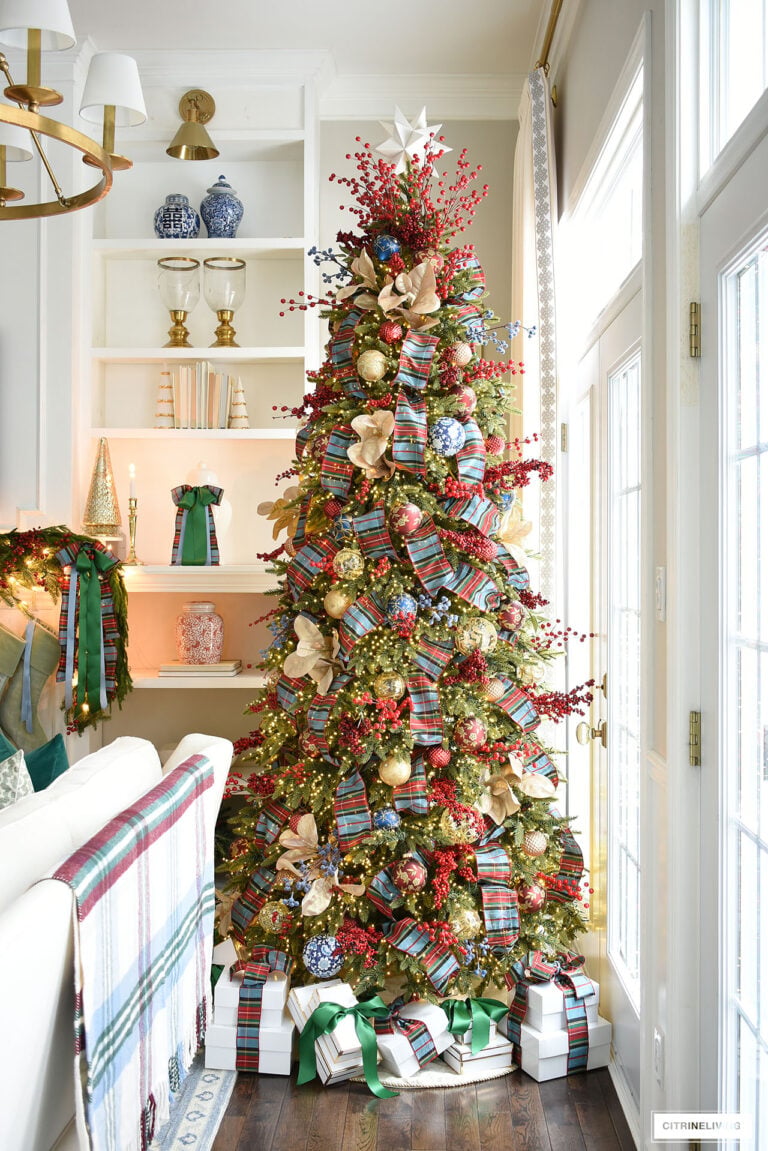 Plaid Ribbon and Berry Accents on a Traditional Christmas Tree Plaid Ribbon and Berry Accents on a Traditional Christmas Tree — Red and Green Christmas Tree