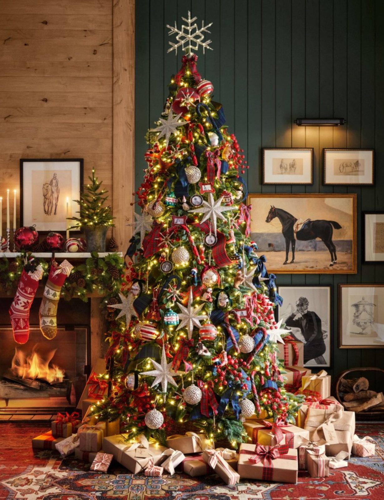 Elaborately Decorated Blue and Silver Christmas Tree by Fireplace Elaborately Decorated Blue and Silver Christmas Tree by Fireplace