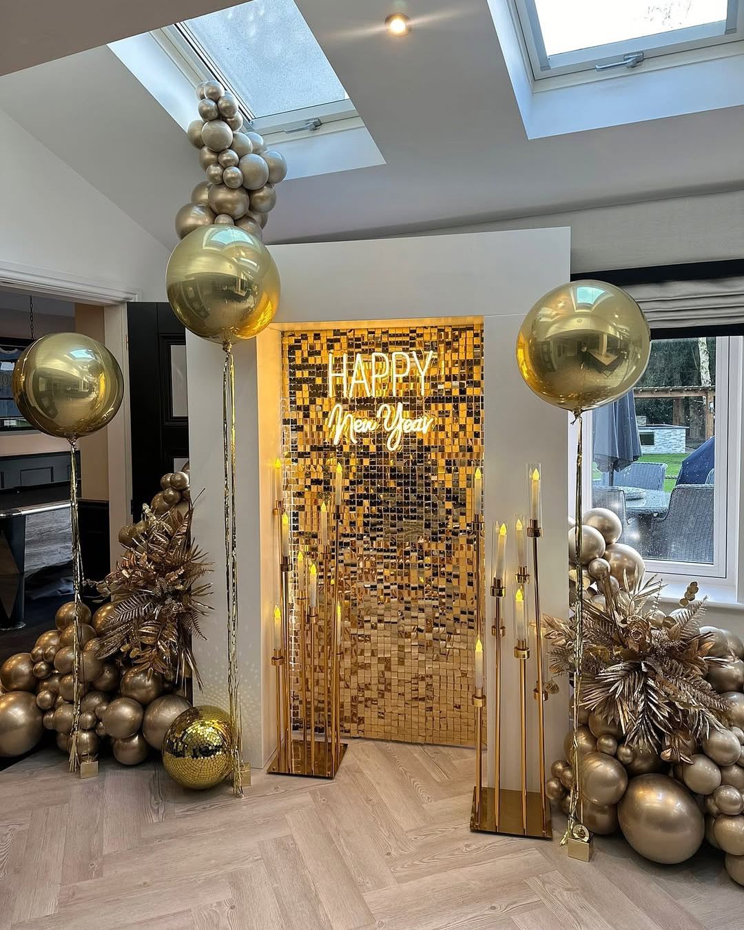 Install a 'Happy New Year' Neon Sign Against a Gold Sequin Wall Install a 'Happy New Year' Neon Sign Against a Gold Sequin Wall — Gold New Years Eve Decor