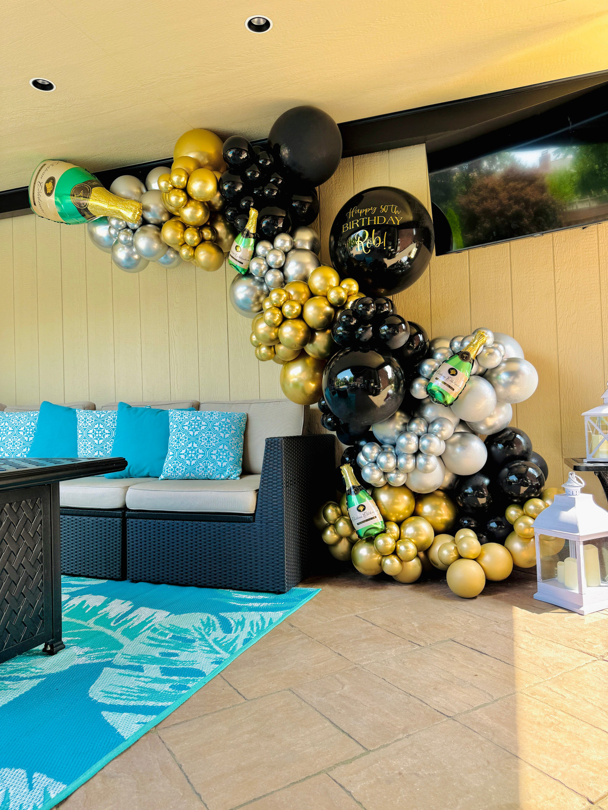 Outdoor Patio New Year's Eve Balloon Garland Draped Over Sectional Sofa Outdoor Patio New Year's Eve Balloon Garland Draped Over Sectional Sofa — New Years Eve Balloon Garland