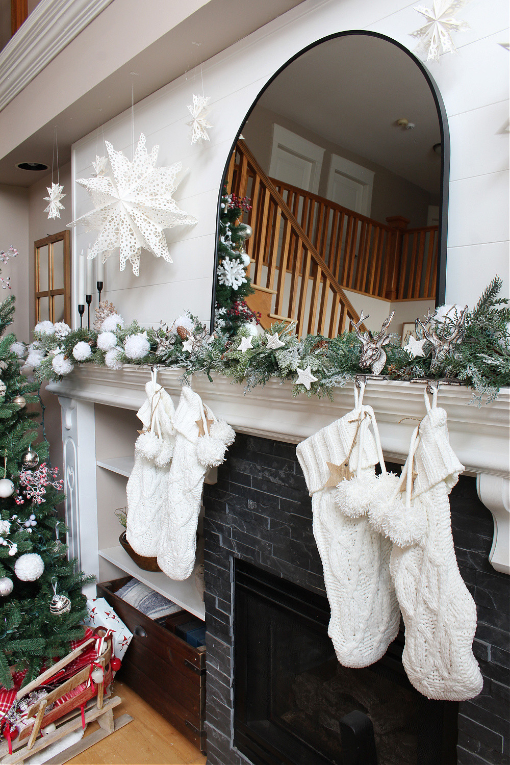 Christmas Mantel with Knit Stockings and Lush Green Garland — Winter Mantel Decor