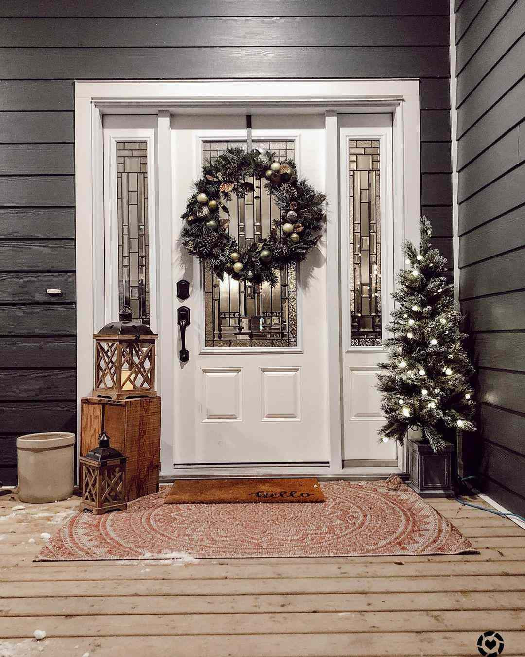 Festive Evening Porch with Lit Tree and Gold Accents Festive Evening Porch with Lit Tree and Gold Accents — Winter Front Door Decor