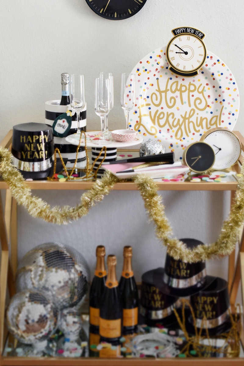 Bar Cart Styled for New Year's Eve with Champagne and Themed Items — New Years Eve Party Decor