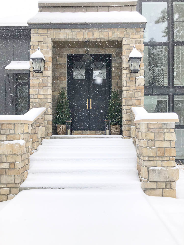 Grand Modern Entrance with Stone Pillars and Snow Grand Modern Entrance with Stone Pillars and Snow — Winter Front Door Decor