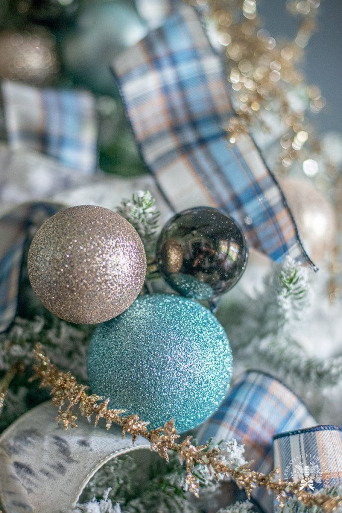 Tree Centered Flocked Christmas Tree with Blue/White Ornaments and Silver Accents Tree Centered Flocked Christmas Tree with Blue/White Ornaments and Silver Accents — Blue and Silver Christmas Tree