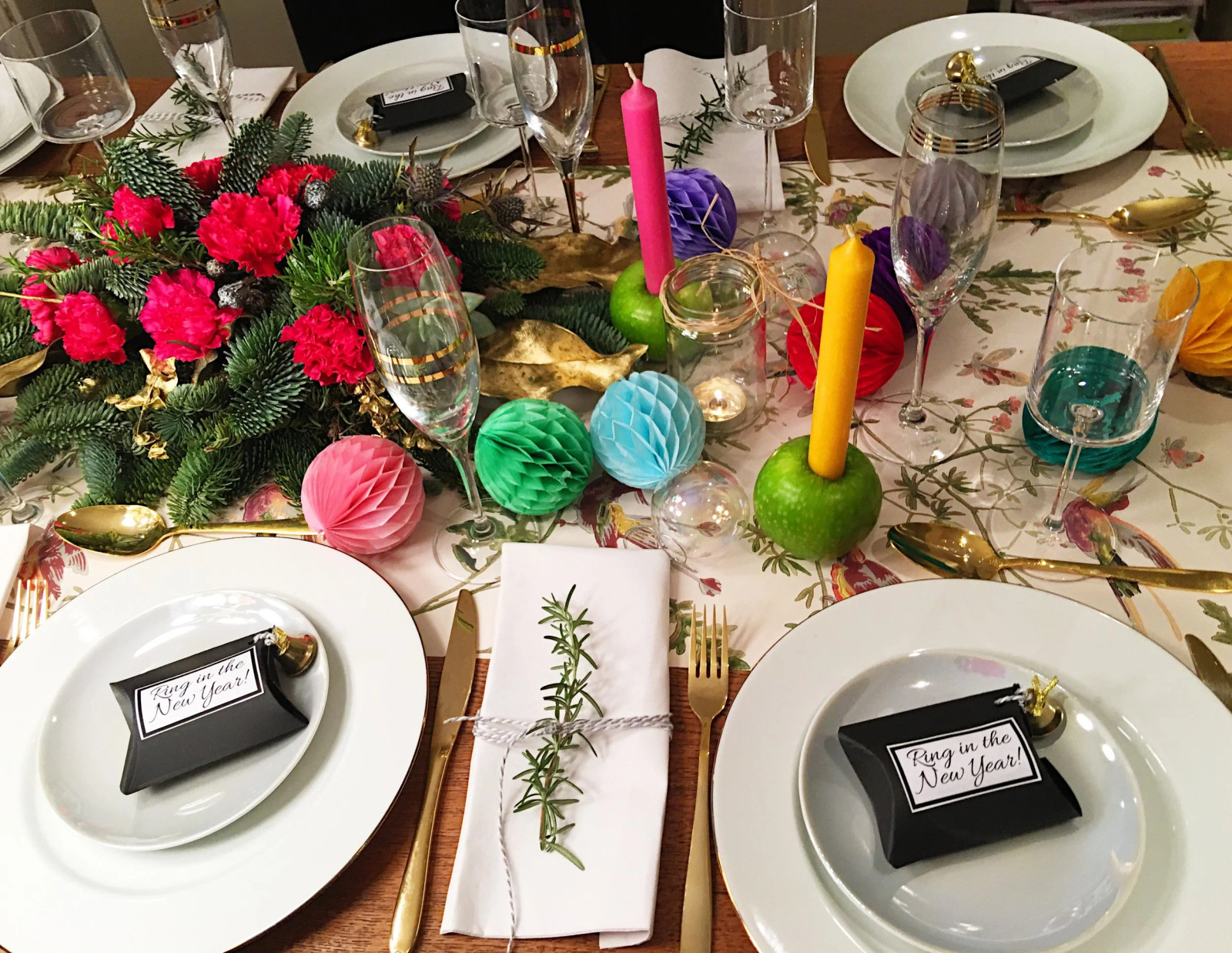 Vibrant Eclectic Table Setting with Colorful Paper Decorations — New Years Eve Table Decor
