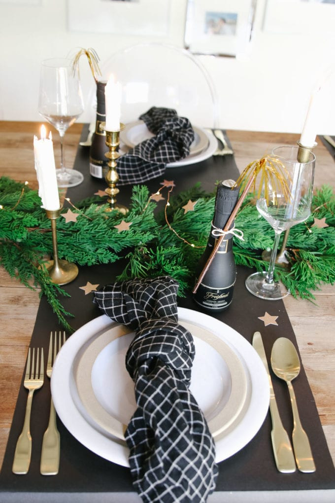 Modern New Year's Eve Table with Gold Cutlery and Garland — New Years Eve Table Decor