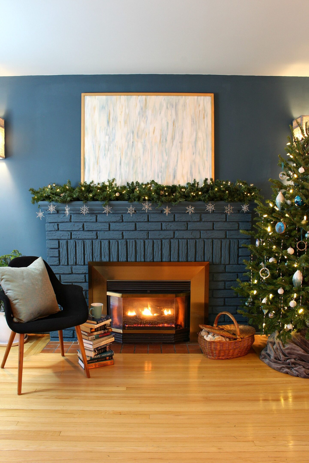 Festive Snowflakes and Garland on a Dark Blue Brick Mantel — Winter Mantel Decor
