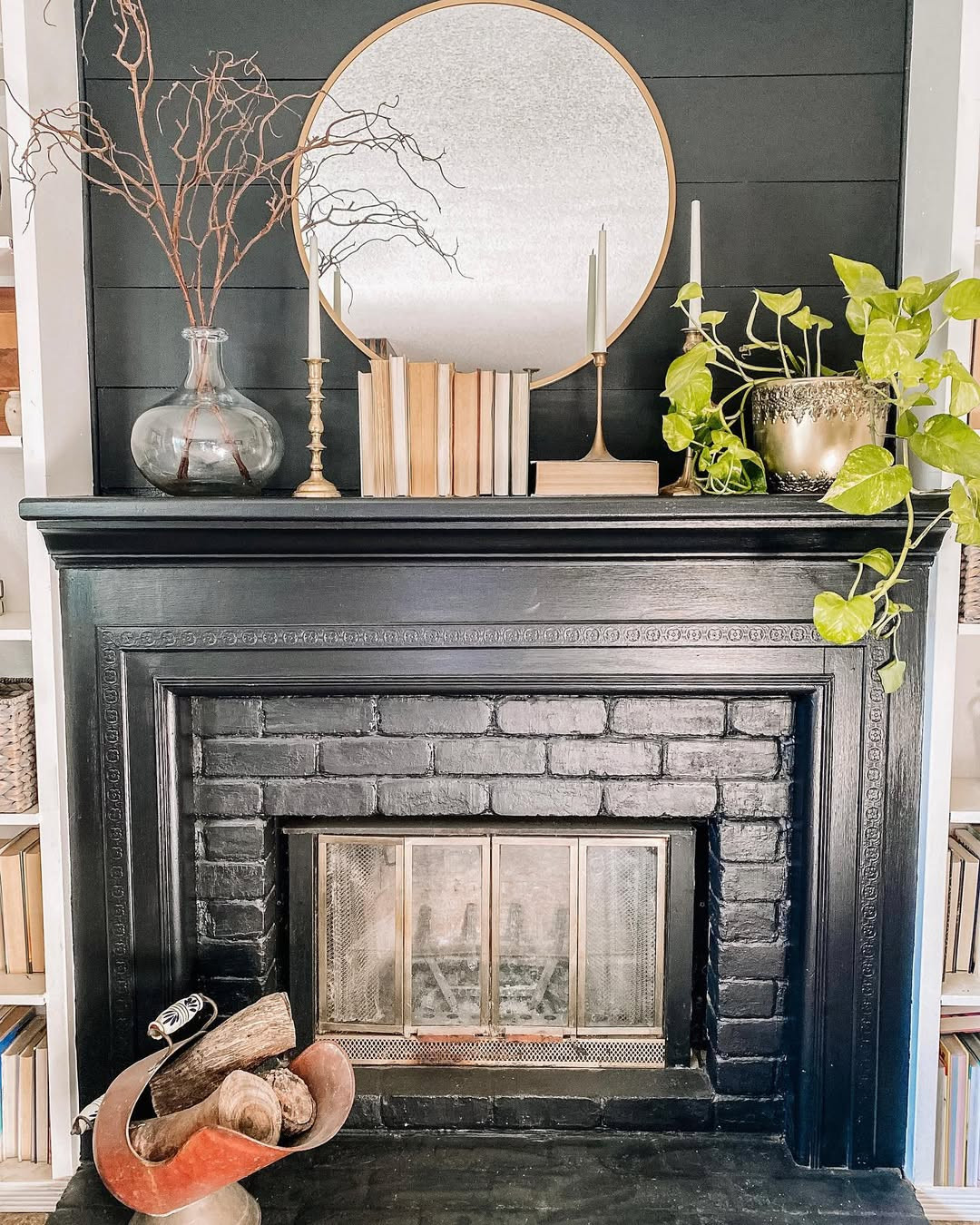 Bold Black Brick Mantel with Round Mirror and Bare Branches — Winter Mantel Decor