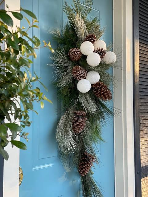 Charming Blue Door with Winter Swag and Natural Elements Charming Blue Door with Winter Swag and Natural Elements — Winter Front Door Decor