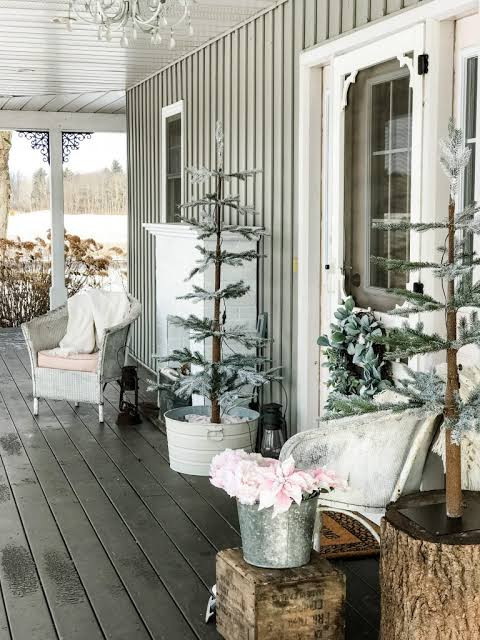 Farmhouse Porch Vignette with Frosted Trees and Wicker Chairs Farmhouse Porch Vignette with Frosted Trees and Wicker Chairs — Winter Porch Decor