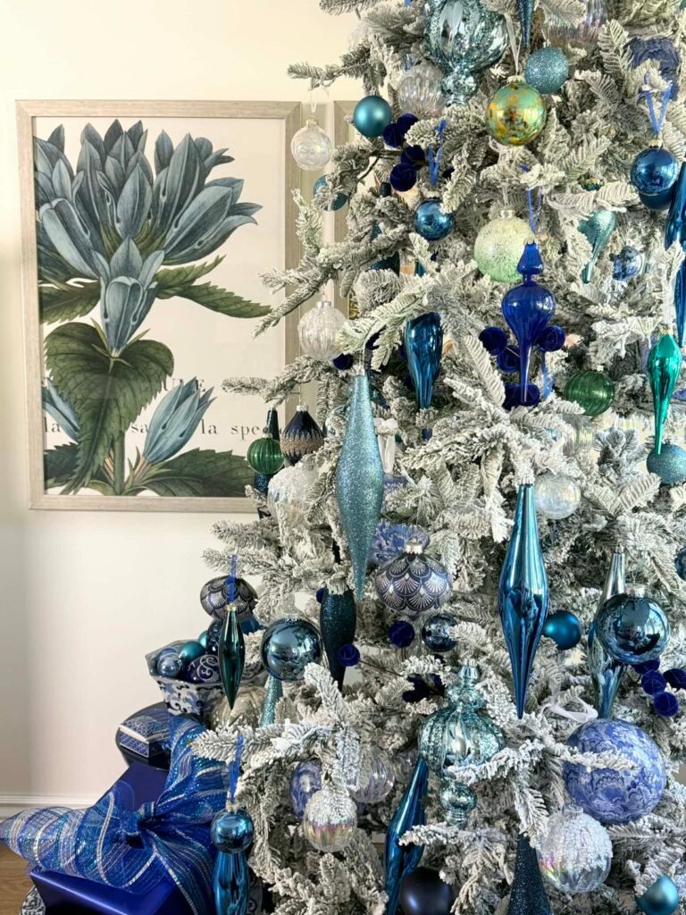 Elegant Living Room with Flocked Tree and Ornate Blue/Silver Baubles Elegant Living Room with Flocked Tree and Ornate Blue/Silver Baubles — Blue and Silver Christmas Tree