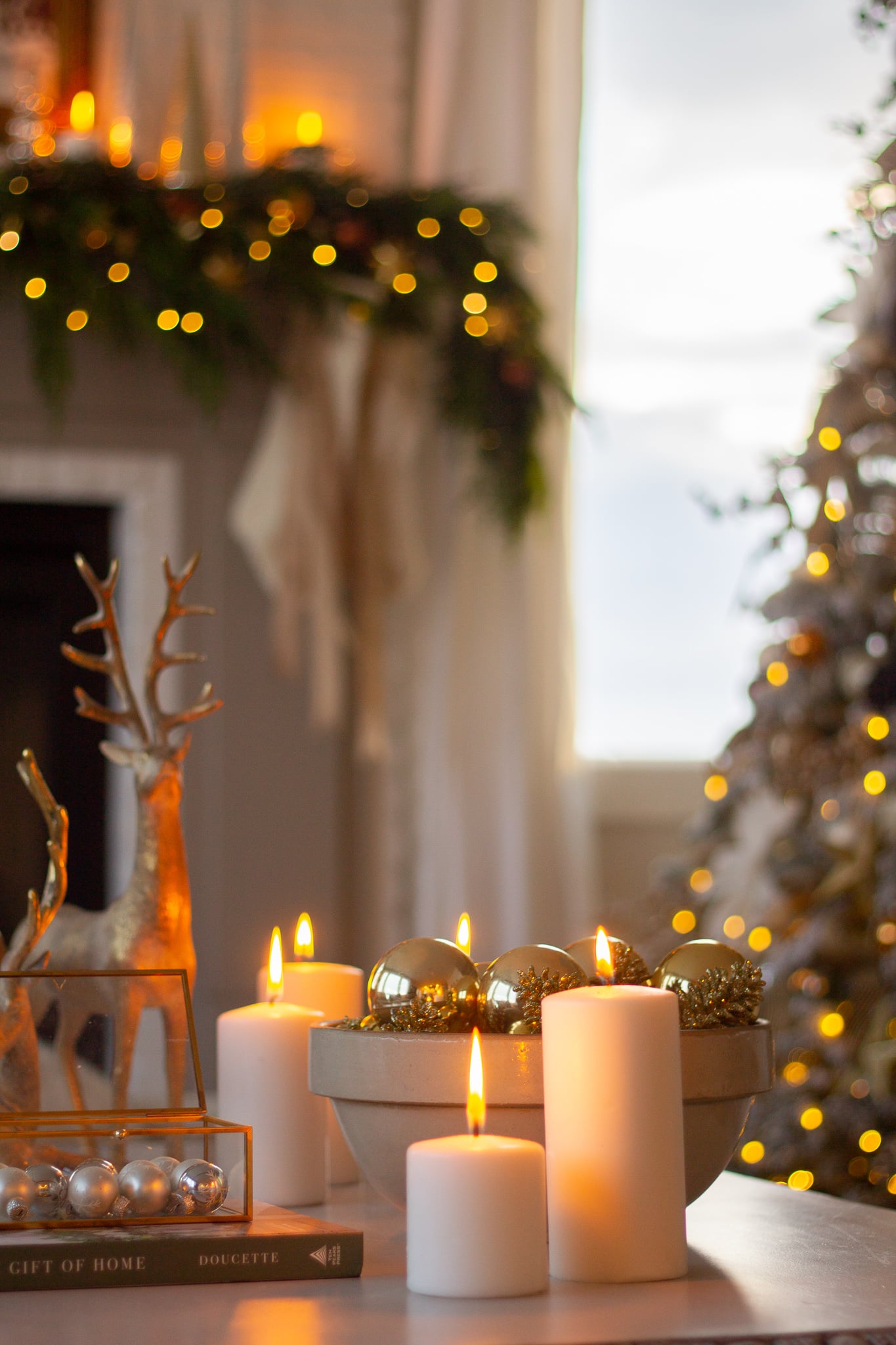 Warm Glow of Multiple Lit Pillar Candles in a Festive Living Room Warm Glow of Multiple Lit Pillar Candles in a Festive Living Room — Christmas Candle Decor