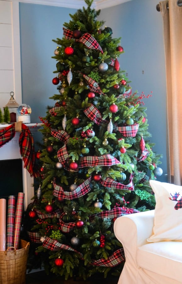 Christmas Tree with Red and Green Plaid Ribbon and Silver Ornaments Christmas Tree with Red and Green Plaid Ribbon and Silver Ornaments — Red and Green Christmas Tree